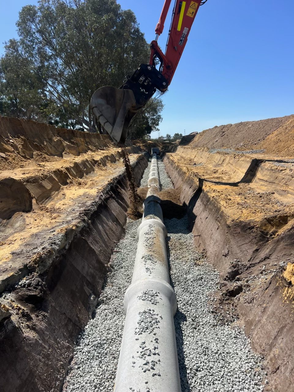 Concrete stormwater drainage pipe installation at Mahala Estate